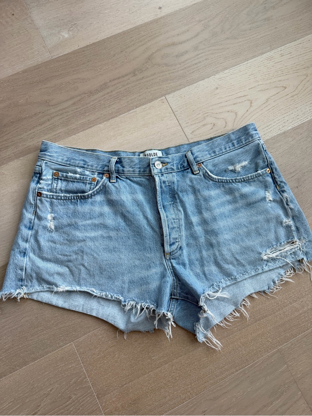 Agolde Faded Light Blue Distressed Denim Cutoff Shorts